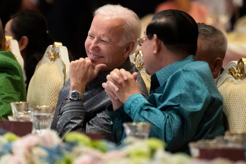 President Joe Biden and Cambodian Prime Minister Hun Sen share a moment as they watch a cultural dance performance at the Association of Southeast Asian Nations gala dinner, Nov. 12, 2022, in Phnom Penh. (Alex Brandon/AP)