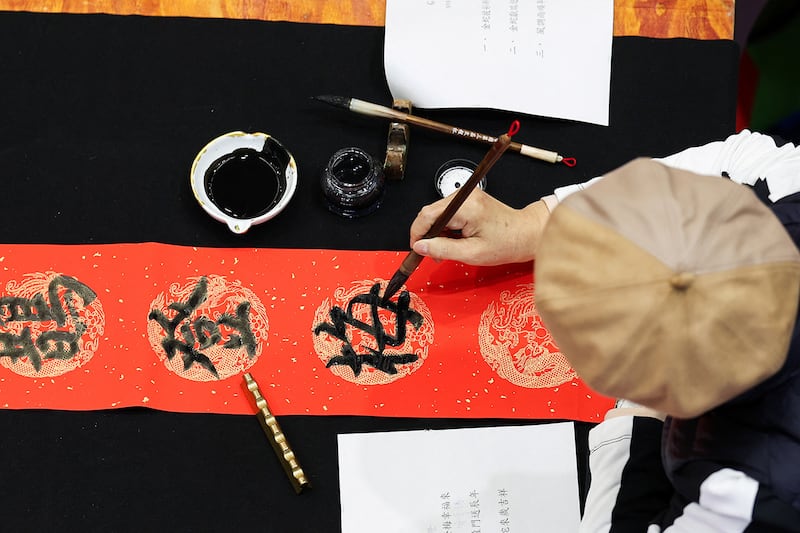 A contestant takes part in an annual spring couplets contest in Taoyuan, Taiwan, Jan. 11, 2025.