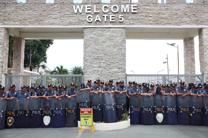 Members of the Philippine National Police standby outside the Villamor Airbase where former Philippine President Rodrigo Duterte is currently held after being arrested, in Pasay City, Metro Manila, Philippines, March 11, 2025. REUTERS/Eloisa Lopez