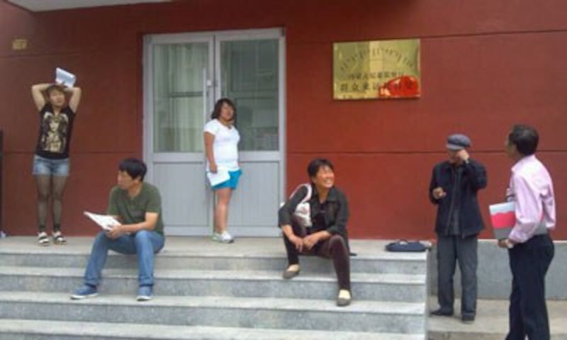 Family members of the six detained herders wait to appeal the Inner Mongolia Letter and Visitation Center in Hohhot. Credit: SMHRIC