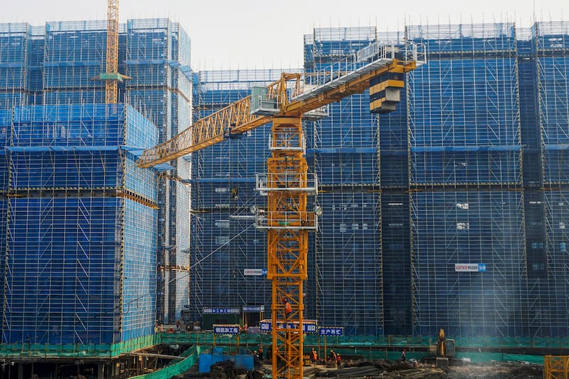 Residential buildings under construction by Chinese real estate developer Vanke in Hangzhou, in eastern China's Zhejiang province, March 31, 2024. (AFP)