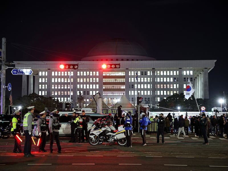 Police officers keep watch outside the National Assembly, after South Korean President Yoon Suk Yeol declared martial law, in Seoul, Dec. 4, 2024.