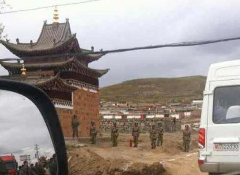 Security forces at the site near a stupa in Tsoe monastery where Tamdin Dorjee set himself on fire on Oct. 13, 2012. Photo courtesy of a Tsoe resident.