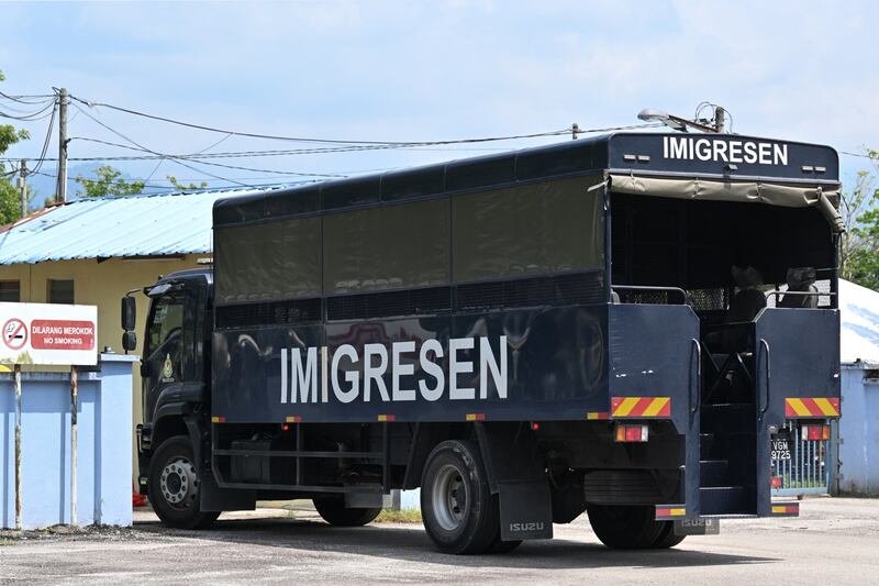 An immigration vehicle enters the detention center in Bidor, in Malaysia’s Perak state, after more than 130 refugees escaped, Feb. 2, 2024. Mohd Rasfan/AFP