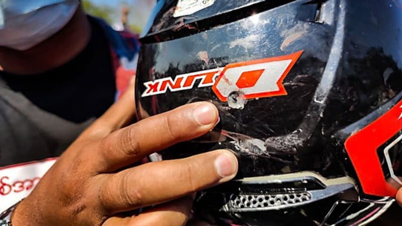 myanmar-protester-shot-helmet-naypyidaw-feb9-2021.jpg