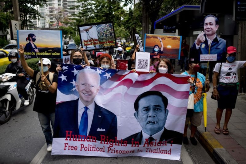 Thai protesters call for the release of prisoners charged under the nation's Lese-Majeste royal defamation law during a rally outside the U.S. Embassy in Bangkok ahead of the U.S.-ASEAN summit in Washington, May 10, 2022. Credit: AFP.