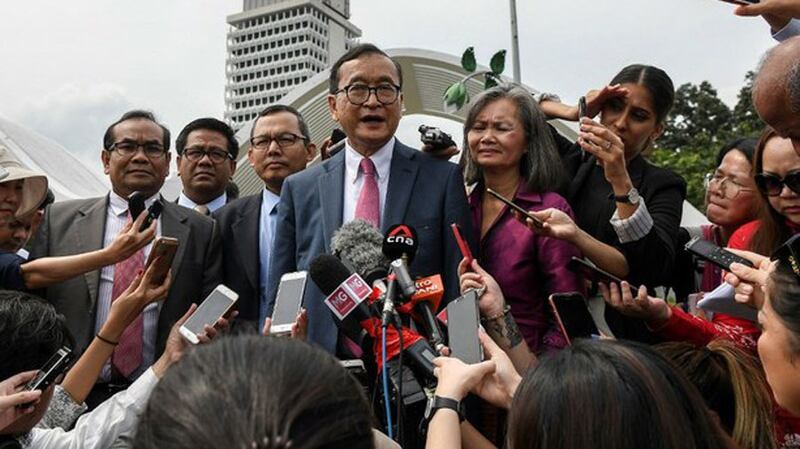 Cambodia's exiled opposition leader Sam Rainsy talks to reporters after meeting legislators at the Parliament House in Kuala Lumpur, Nov. 12, 2019.