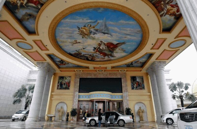 Vehicles stop at the entrance to the Kings Romans Casino, part of the Golden Triangle Special Economic Zone in northwestern Laos' Bokeo province, Jan. 14, 2012. Credit: Reuters