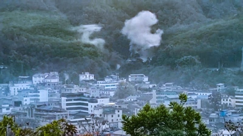 Smoke rises after artillery shells fired by Myanmar junta troops land in Chinese territory during recent fighting near Laiza, Myanmar. (Image from citizen journalist video)