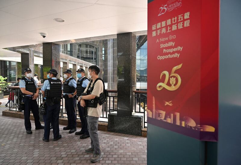 Police gather in the Wanchai district of Hong Kong on June 29, 2022, close to where celebrations to mark the 25th anniversary of the handover of Hong Kong from Britain to China took place on July 1. Credit: AFP