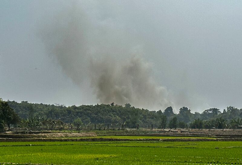 Smoke rises from a Myanmar Border Police post following fighting with Arakan Army forces near Ghumdhum, Bangladesh, Feb. 5, 2024. (Shafiqur Rahman/AP)