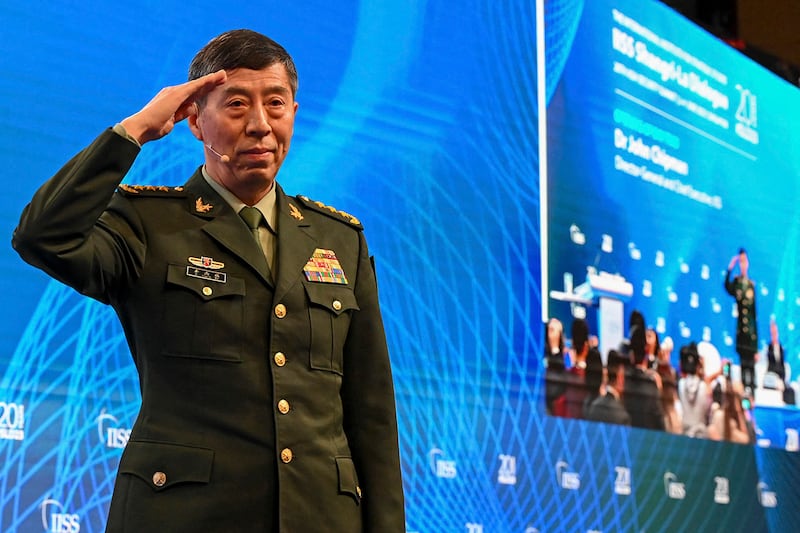 China's then-Minister of National Defence Li Shangfu salutes the audience before delivering a speech during the 20th Shangri-La Dialogue summit in Singapore on June 4, 2023.