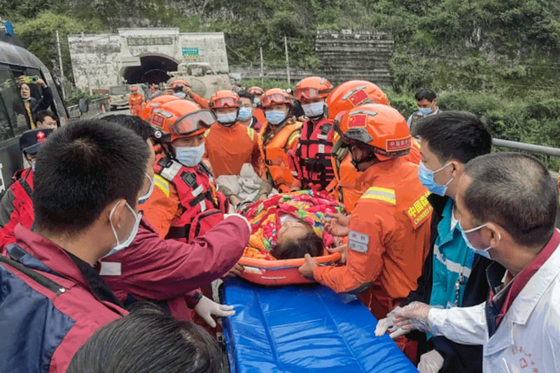 Rescue workers carry an injured person after a 6.8-magnitude earthquake in Luding county, Ganzi prefecture, in southwestern China's Sichuan province, Sept. 6, 2022. Credit: CNS/AFP