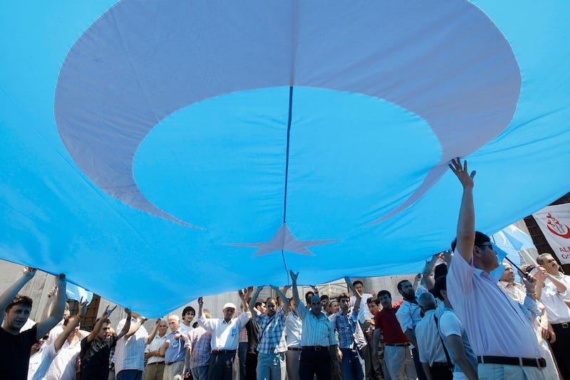 Demonstrators display the flag of East Turkestan during a protest in Istanbul, Turkey, July 10, 2009.