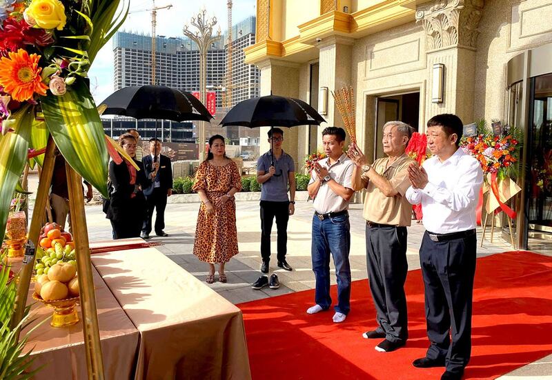 Rithy Samnang, third from right, and Xu Aimin, right, attend the opening ceremony in December 2019 for their KB Hotel & Casino on Xu Aimin Avenue, near Otres beach, Sihanoukville. Credit: MAX Media