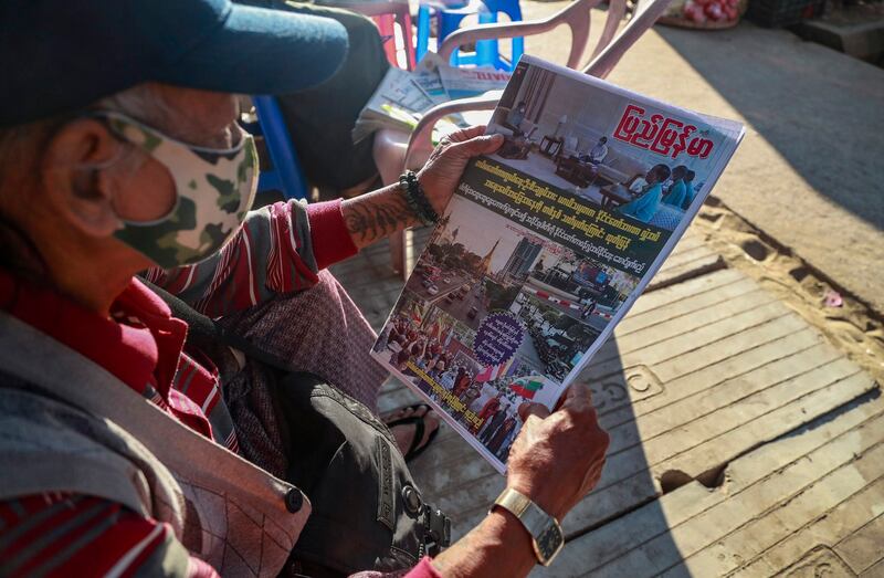 A man in Yangon, Myanmar, looks at a newspaper, which reports "1 year of State of Emergency and Acting President transferred Power to Military Chief" on Feb. 2, 2021. Since then, the ruling junta has shut down all independent newspapers in the country. Credit: Associated Press