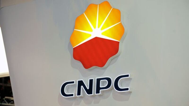 The logo of China's largest oil producer China National Petroleum Corporation hangs on a wall during the World Gas Conference exhibition in Paris, June 2, 2015.