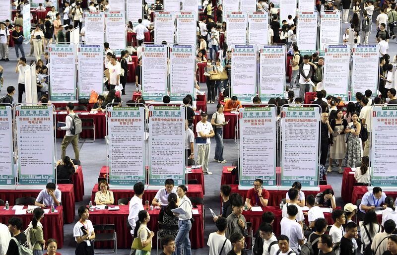 People attend a job fair for university graduates at a gymnasium in Hefei, Anhui province, China, Sept. 4, 2023. Credit: China Daily via Reuters