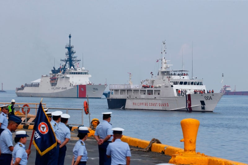 The U.S. Coast Guard cutter Bertholf (left) and the Philippine Coast Guard ship Batangas arrive in Manila following a joint exercise in the South China Sea, May 15, 2019. Credit: AP