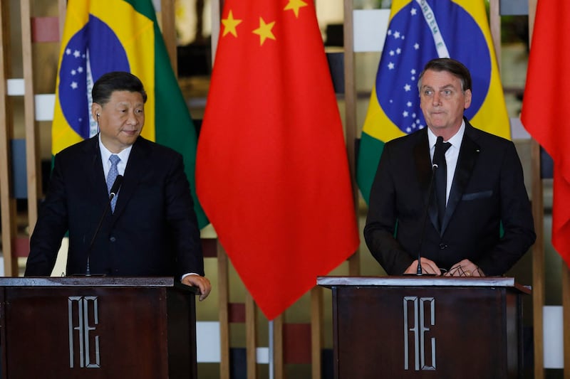 Chinese President Xi Jinping (L) and Brazilian President Jair Bolsonaro attend a press statement after their bilateral meeting at Itamaraty Palace in Brasilia, Brazil, on November 13, 2019. Credit: AFP