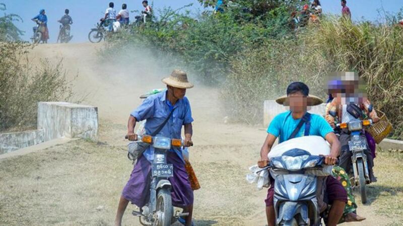 Residents from the northern part of Salingyi township in northwestern Myanmar's Sagaing region flee amid raids conducted by Myanmar junta toops, March 29, 2024. Their faces have been blurred to protect their identity. (Chindwin River Bank Villages Strike Committee)