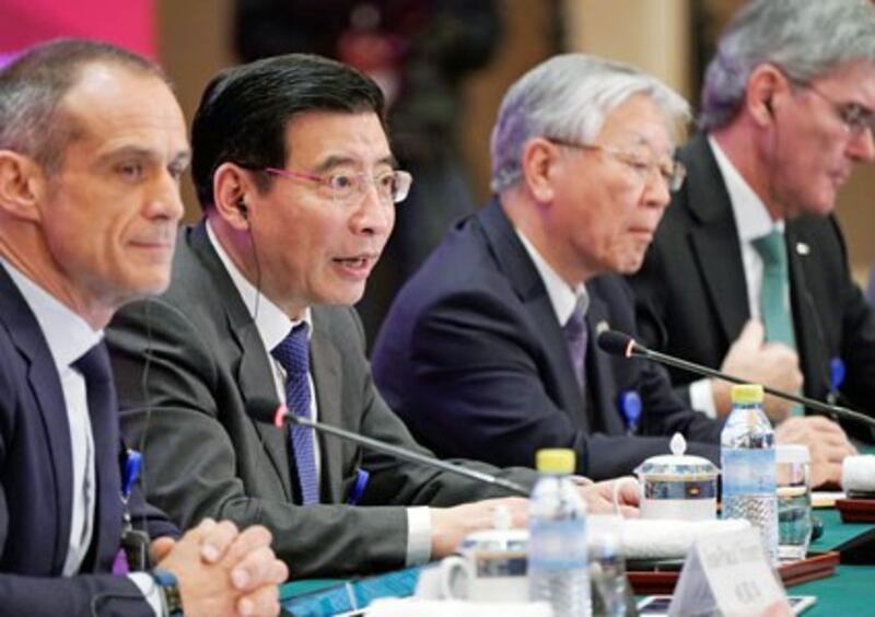 Miao Wei (2nd from L), China's minister of industry and information technology, speaks at the annual session of the China Development Forum at the Diaoyutai State Guesthouse in Beijing, March 26, 2018.