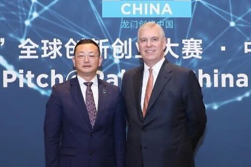 Britain's Prince Andrew, right, stands with Yang Tengbo in an image shown at the "Most Accomplished Chinese Award" ceremony in 2019, where Yang received the "Outstanding Chinese Award."