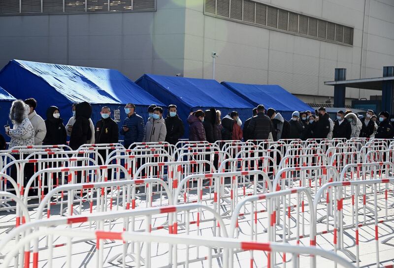 People queue for a swab test for the Covid-19 coronavirus in Beijing, Jan. 31, 2022. Credit: AFP