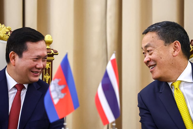 Cambodia Prime Minister Hun Manet and Thailand's Prime Minister Srettha Thavisin laugh during a press conference in Bangkok, Feb. 7, 2024.