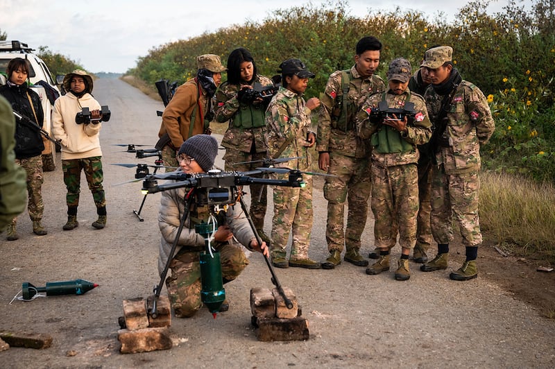 Members of the Mandalay People's Defense Force prepare to release a drone amid clashes with Myanmar's military in northern Shan state, Dec. 11, 2023.