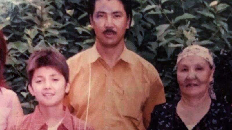 Merdan Ghappar (L) as a teenager in a photo with his uncle Abdulhakim Ghappar (C) and his grandmother (R).