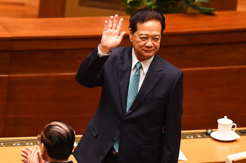 Vietnam's former prime minister Nguyen Tan Dung waves at the opening of the National Assembly's autumn session in Hanoi on October 20, 2022.