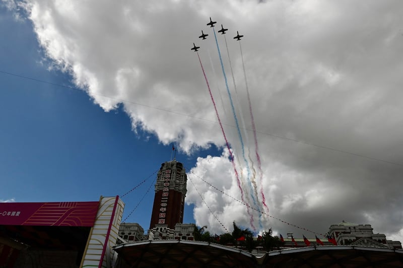 Taiwanese Air Force AT-3 jets fly over the Presidential Palace during national day celebrations in Taipei, Oct. 10, 2021. Credit: AFP