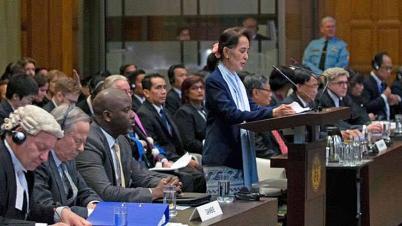 Myanmar State Counselor Aung San Suu Kyi (standing) addresses the judges of the International Court of Justice during a three-day hearing on the Rohingya genocide case against Myanmar at The Hague, the Netherlands, Dec. 11, 2019.