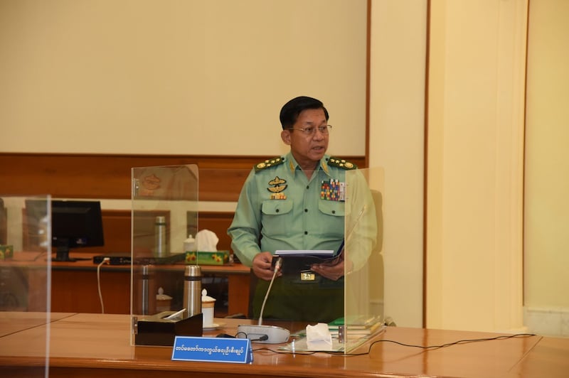 Junta chief Snr. Gen. Main Aung Hlaing addresses the National Defense and Security Council during a special meeting in the capital Naypyidaw, Jan. 31, 2022. National Defense and Security Council