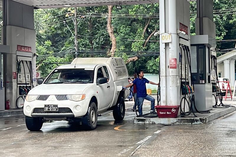 A driver fuels his vehicle in Yangon, Myanmar, Aug. 12, 2022. Credit: RFA