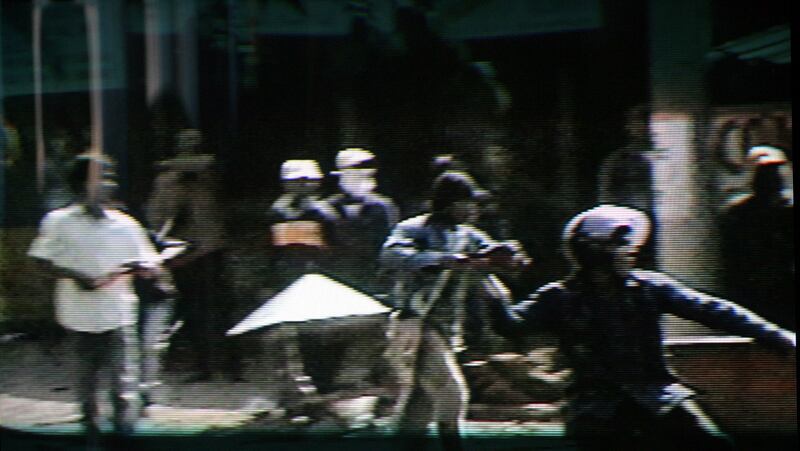 Montagnard villagers throw stones during a protest in Vietnam's central highland province of Dak Lak in this screenshot from video taken on April 10, 2004. Credit: Dak Lak Provincial People Committee handout via Reuters