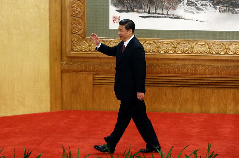 Newly elected General Secretary of the Central Committee of the Communist Party of China Xi Jinping waves as he leaves after meeting with the press at the Great Hall of the People in Beijing, China, Nov. 15, 2012. Credit: Reuters