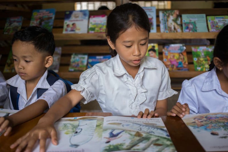 A student reads at Banlech Prasat Primary School, Prey Veng Province, Cambodia, undated photo.