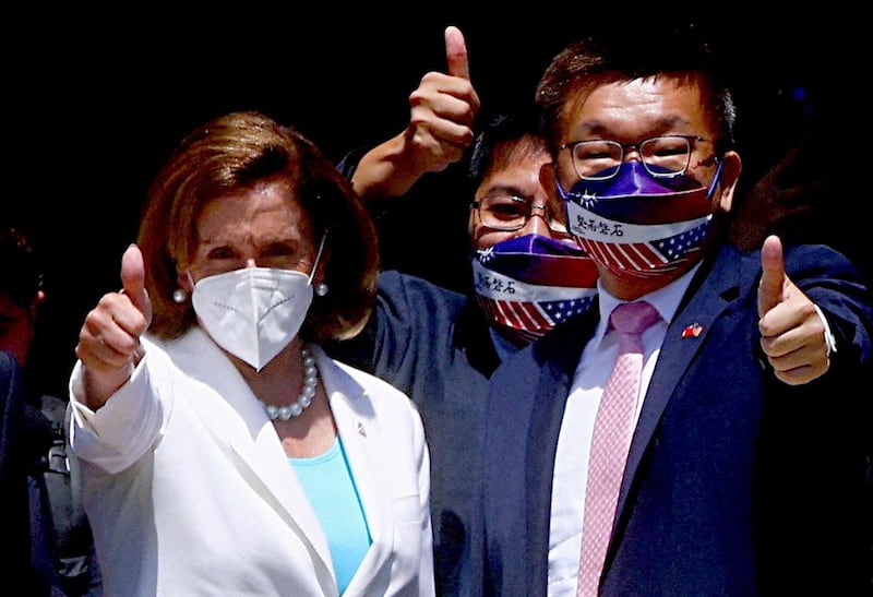 U.S. House of Representatives Speaker Nancy Pelosi gestures next to Legislative Yuan Vice President Tsai Chi-chang as she leaves the parliament in Taipei, Taiwan August 3, 2022. Credit: Reuters