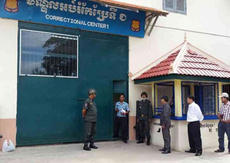 People wait at an entrance to Prey Sar Prison on the outskirts of Phnom Penh, Cambodia, in an undated file photo. Credit: RFA/Uon Chhin