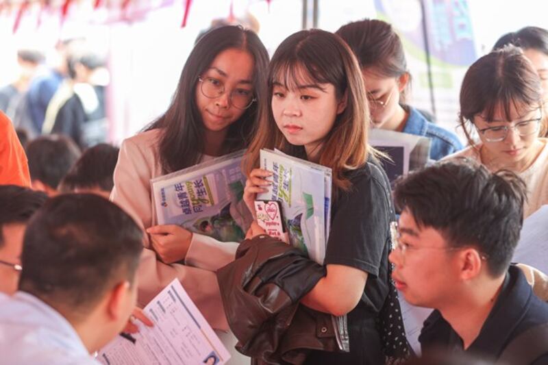 College graduates look for employment opportunities at a Nanchang University job fair in Nanchang, Jiangxi province, China, Oct. 14, 2023. (Liu Lixin/China News Service/VCG via Getty Images)