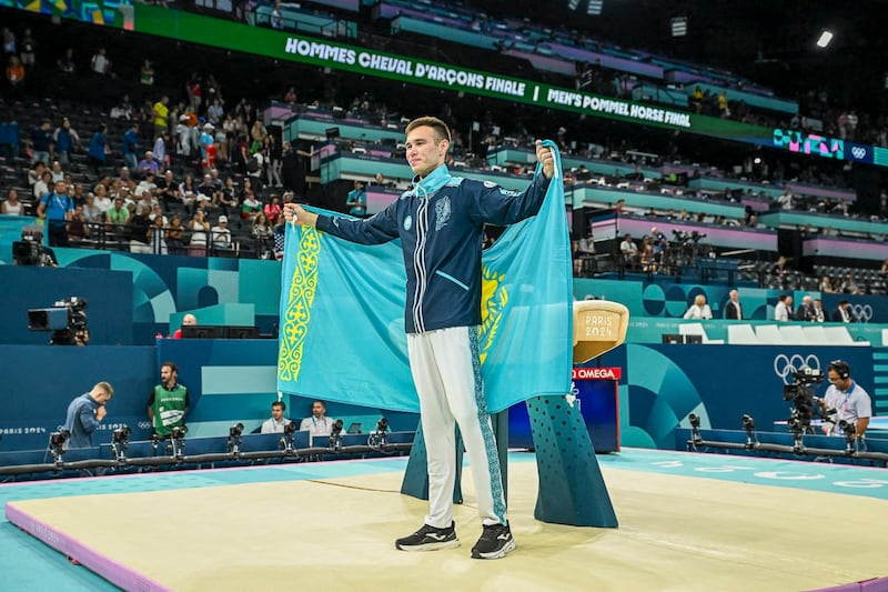 Silver medallist Kazakhstan's Nariman Kurbanov celebrates after the artistic gymnastics men's pommel horse final during the Paris 2024 Olympic Games at the Bercy Arena in Paris, Aug. 3, 2024. (Paul Ellis/AFP)