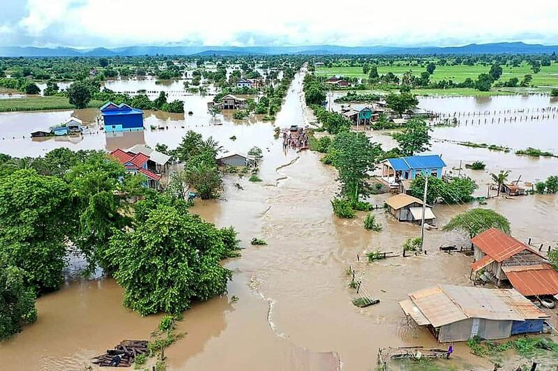 This aerial photo taken on October 10, 2020 shows a flooded village in Cambodia's western Battambang province, following heavy rains in the region. STR / AFP