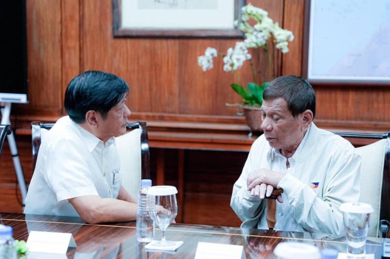 President Ferdinand Marcos Jr. talks to his predecessor, Rodrigo Duterte, during a meeting at the presidential palace in Manila, Aug. 2, 2023. Credit: Handout photo/Presidential Communications Office