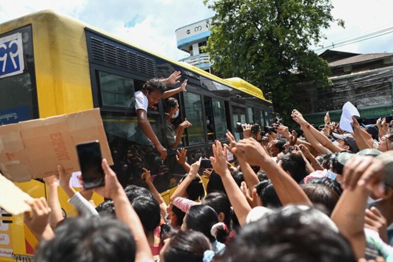 Detainees released from Insein Prison celebrate with the crowd amid a prisoner amnesty in Yangon, Myanmar, Oct. 19, 2021. (AFP)