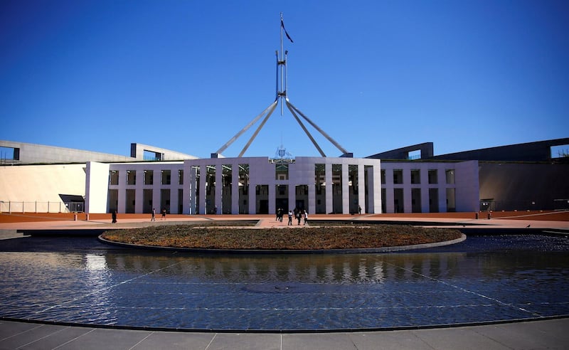 Tourists walk around the forecourt of Australia's Parliament House in Canberra, Australia, October 16, 2017. Credit: Reuters