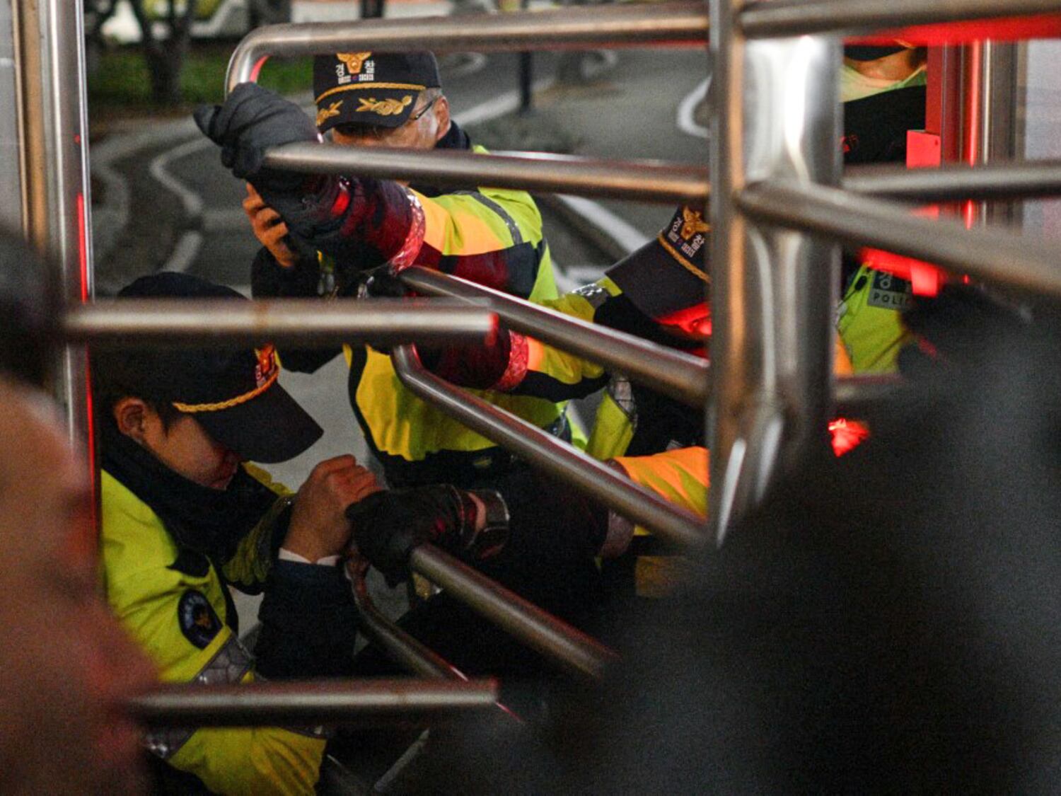 Police attempt to prevent people from entering the National Assembly in Seoul on Dec. 4, 2024, after South Korea President Yoon Suk Yeol declared martial law.