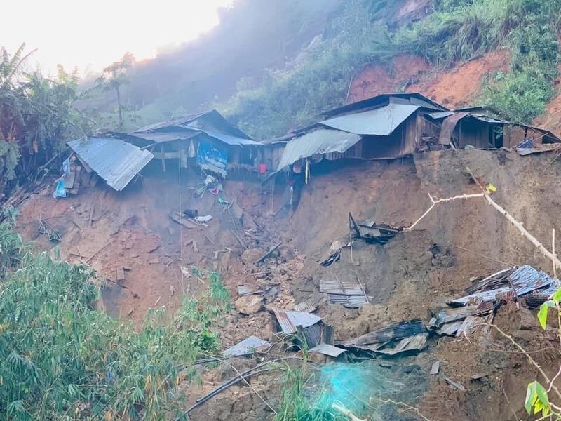 A landslide damages houses in a village in Phuoc Loc district, Quang Nam province, Vietnam Thursday, Oct. 29, 2020. Three separated landslides triggered by Typhoon Molave killed more than a dozen villagers in the province as rescuers scramble to recover more victims. 