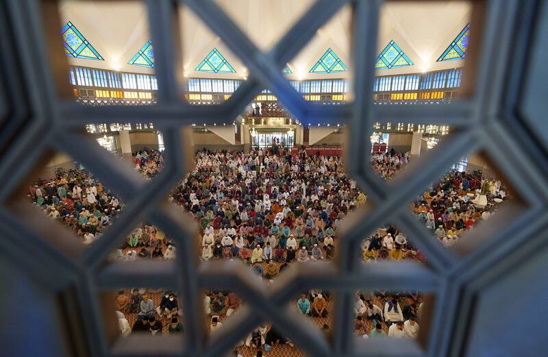 People pray at the National Mosque for the Eid al-Fitr, marking the end of the holy fasting month of Ramadan in Kuala Lumpur, April 22, 2023. Suicide rates for women in Malaysia decreased by 22 percent but just 0.7 percent for men between 2000 and 2019. (Vincent Thian/AP)